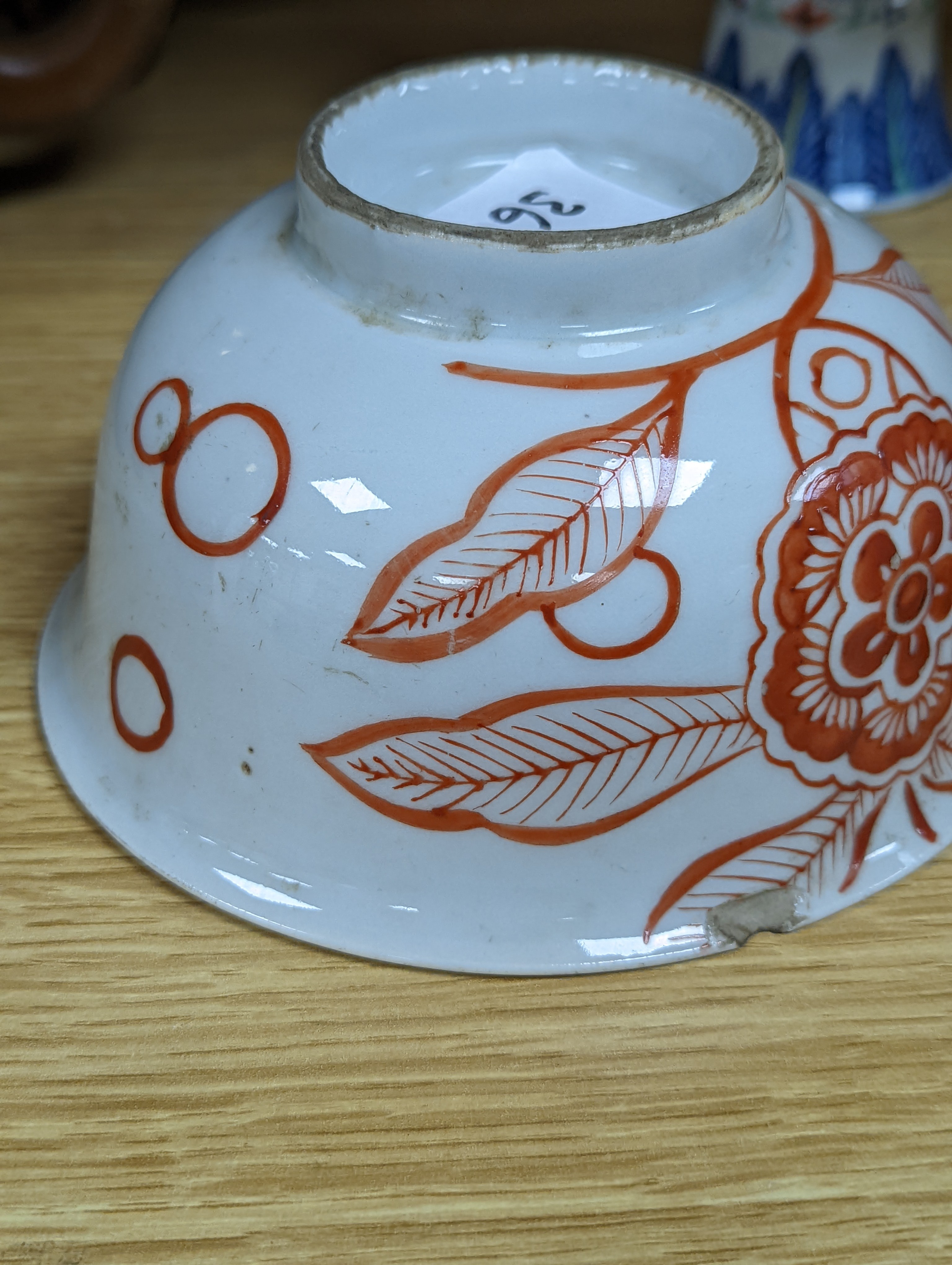 A Chinese blue and white water pipe vessel, a doucai stem dish and a Japanese Imari bowl, 19th century, (3)